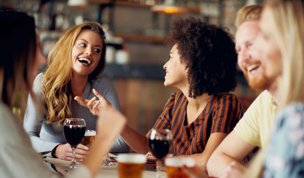 : Serbian locals sitting at the cafe and using some Serbian slang words while talking