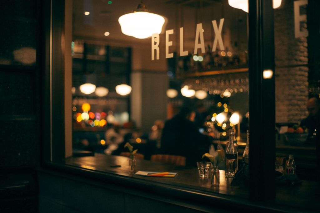 A person sitting in a restaurant in the evening