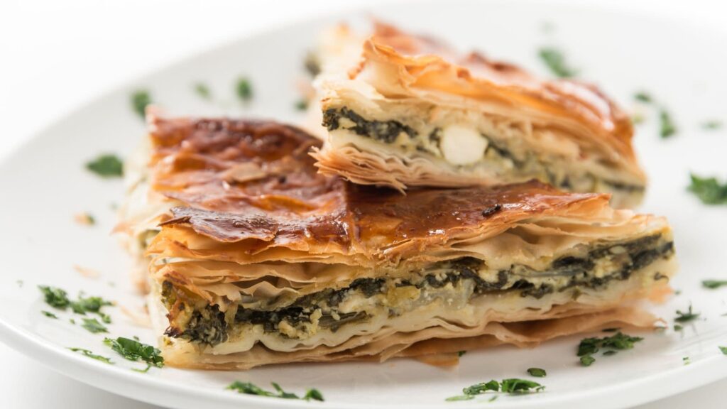 Slices of pie with spinach and cheese
