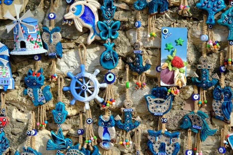 Many seaside souvenirs hanging on the wall.