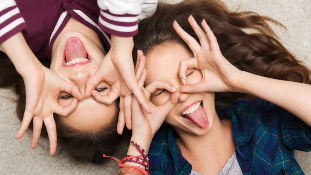 Two girlfriends hanging out and being silly