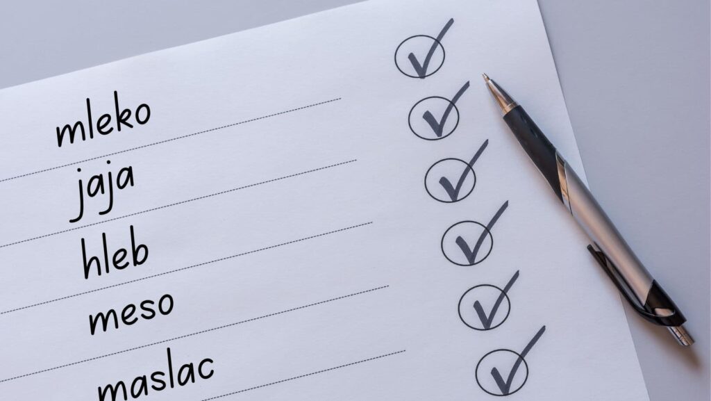 A shopping list with basic supplies written.