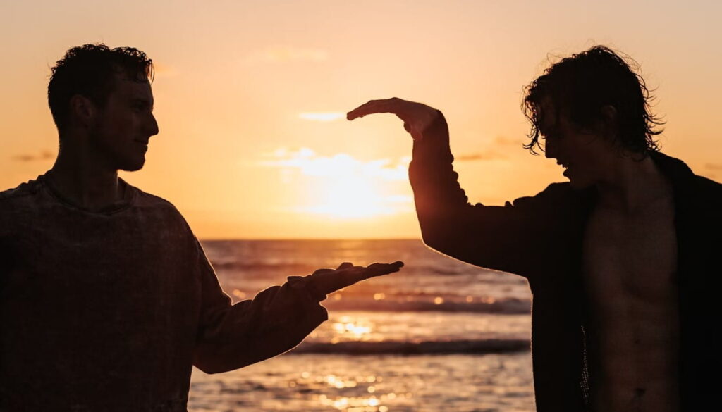 Two friends greeting each other with a high-five.