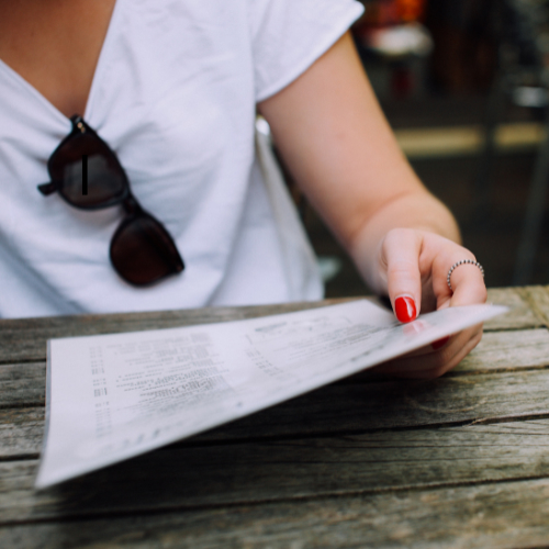 A person reading a menu.