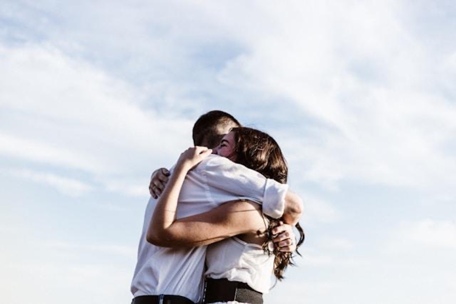 A man and a woman hugging each other