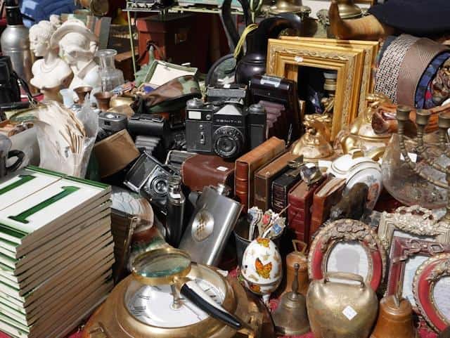 Various trinkets on a flea market stand.