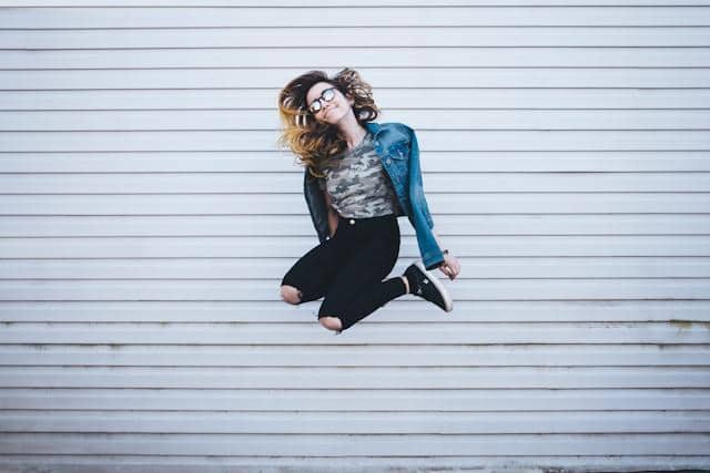 A woman jumping up high in the air.