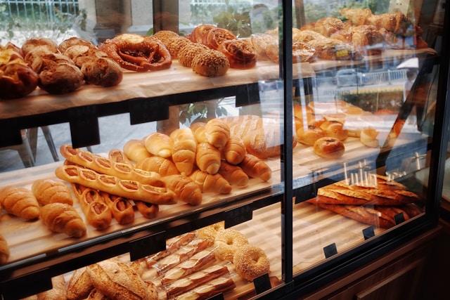 Baked goods on a display shelf at a bakery.