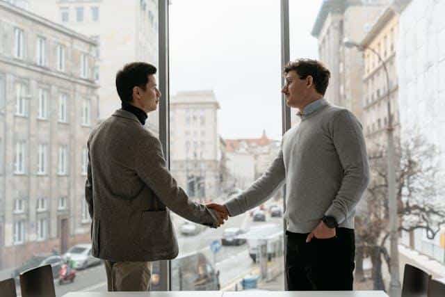 Two men shaking hands.