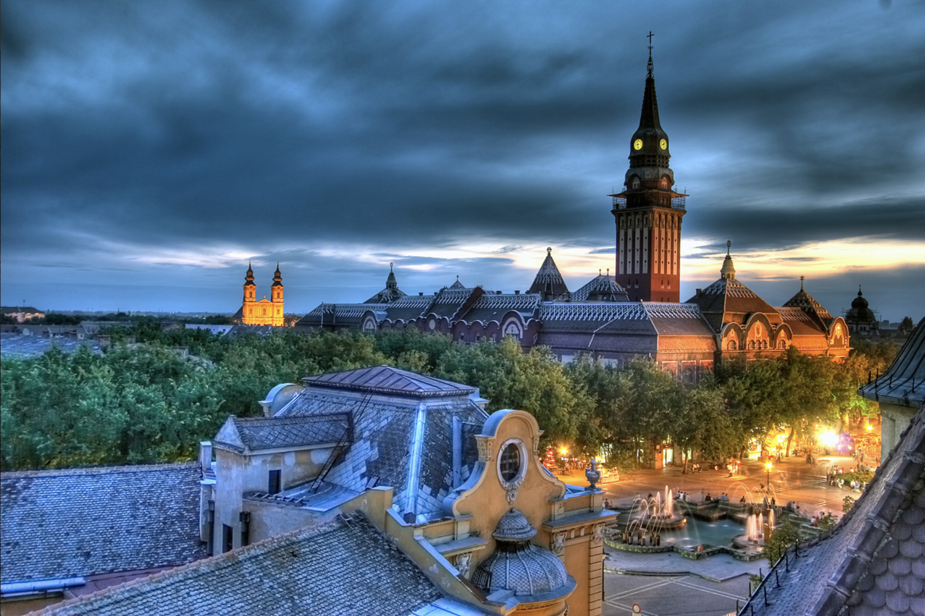 A city landscape with a cloudy sky